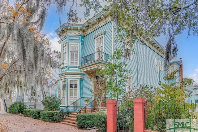 italianate-style house with a balcony