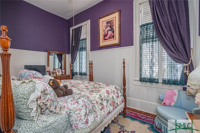 bedroom with hardwood / wood-style floors