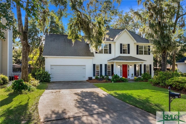 colonial house with a front lawn and a garage