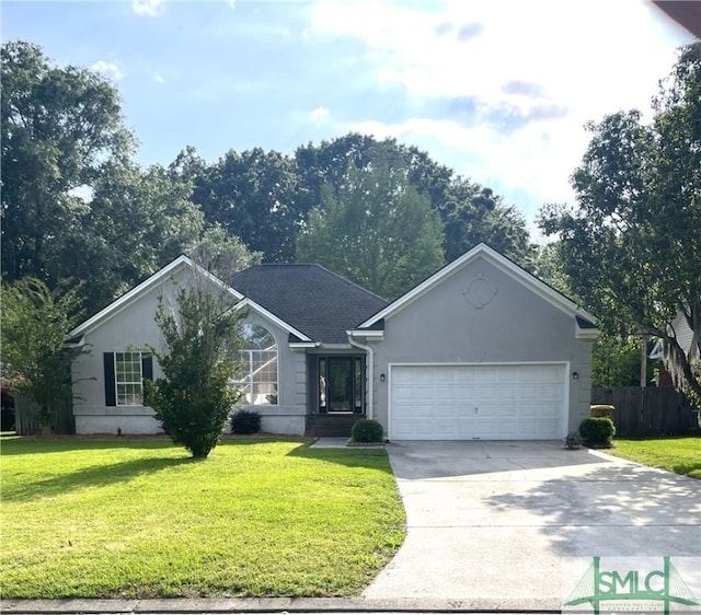 ranch-style home with a garage and a front lawn