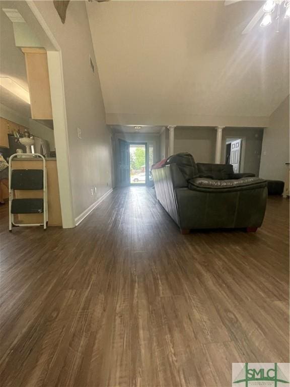 living room featuring dark hardwood / wood-style flooring and ceiling fan