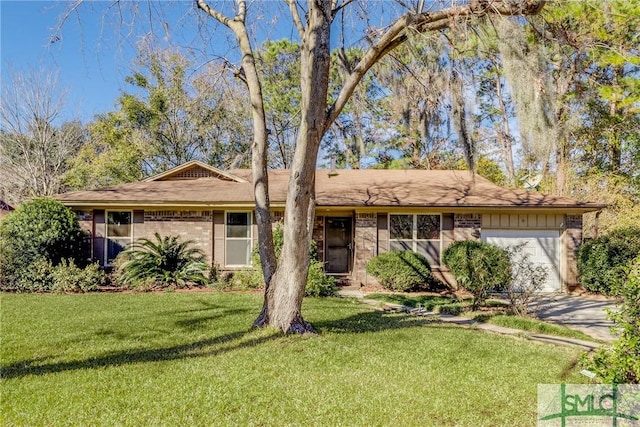 single story home featuring a front yard and a garage