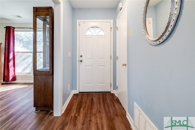 entryway with dark hardwood / wood-style flooring