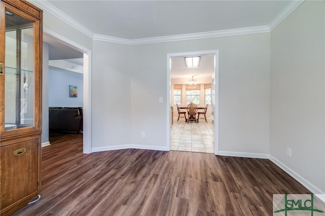 unfurnished room featuring dark hardwood / wood-style floors and crown molding