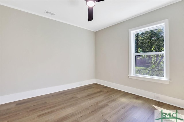 unfurnished room with ceiling fan, light hardwood / wood-style floors, and a wealth of natural light