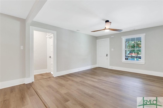 empty room with light hardwood / wood-style flooring and ceiling fan