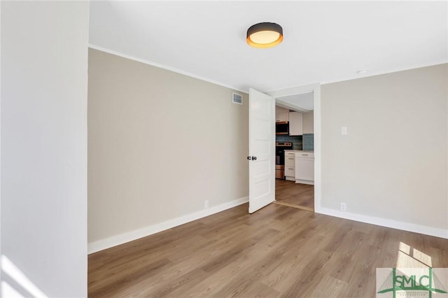 unfurnished room featuring light wood-type flooring