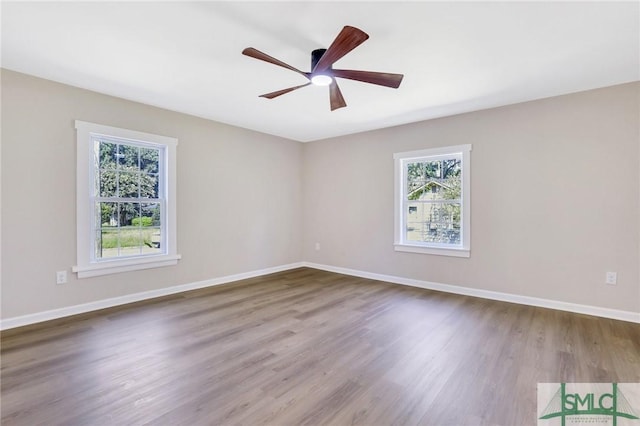 unfurnished room featuring hardwood / wood-style floors and ceiling fan