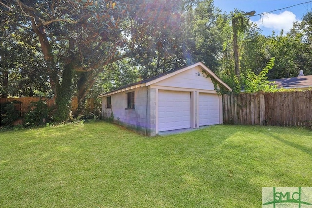 garage featuring a lawn