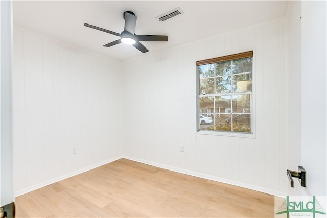 spare room featuring ceiling fan and light hardwood / wood-style floors