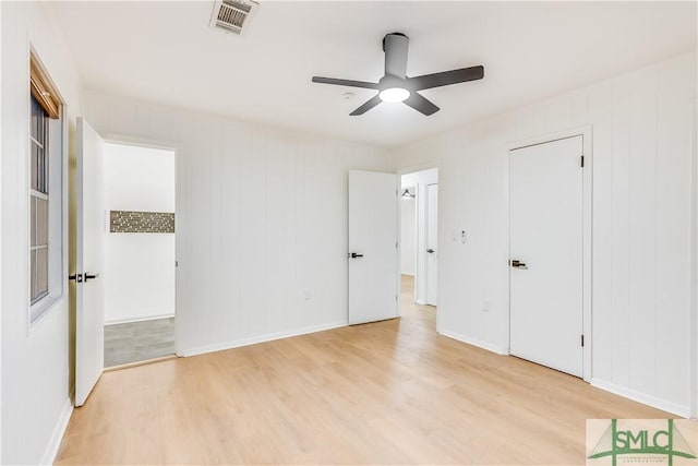 unfurnished bedroom with ceiling fan and light hardwood / wood-style flooring