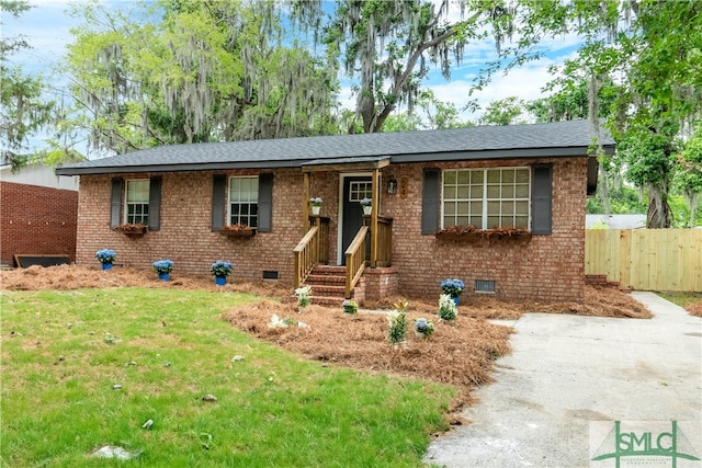 single story home with crawl space, roof with shingles, and brick siding