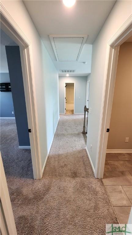 corridor with light colored carpet