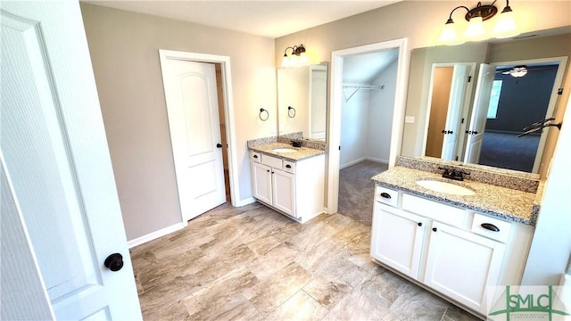 bathroom with vanity and ceiling fan