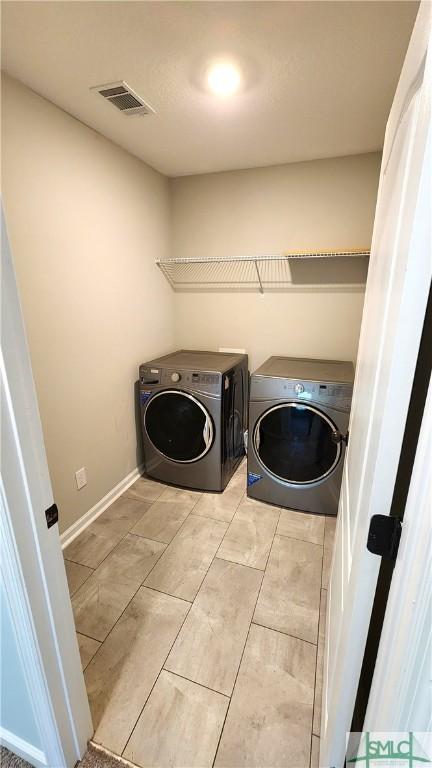 laundry room with washer and dryer