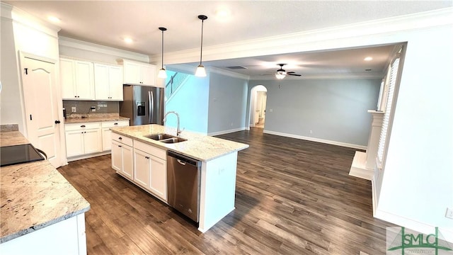 kitchen with sink, hanging light fixtures, a kitchen island with sink, white cabinets, and appliances with stainless steel finishes