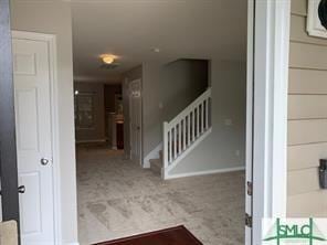 entryway with carpet