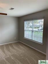 empty room featuring carpet flooring