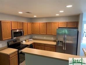 kitchen with a center island and stainless steel appliances