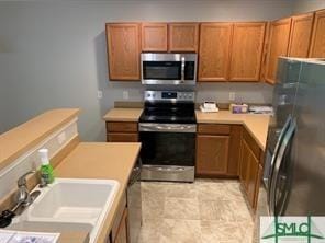 kitchen featuring sink and appliances with stainless steel finishes