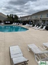 view of pool featuring a patio