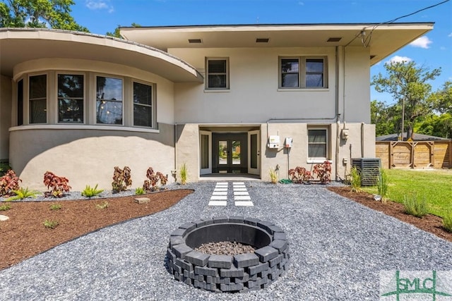 exterior space featuring central AC unit and french doors