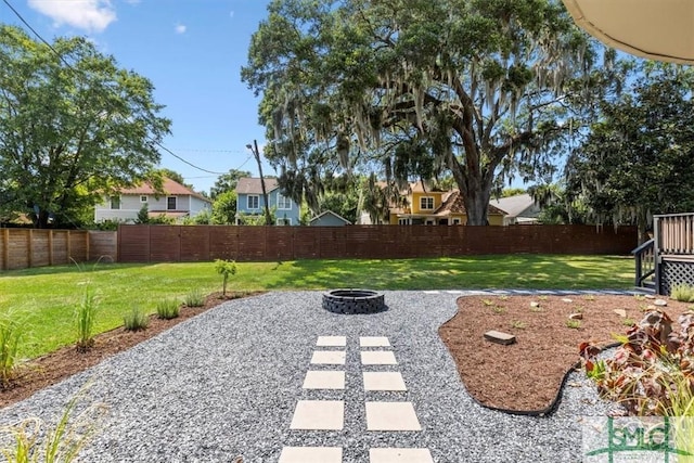 view of yard with a fire pit