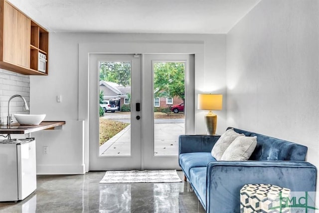 doorway to outside featuring sink