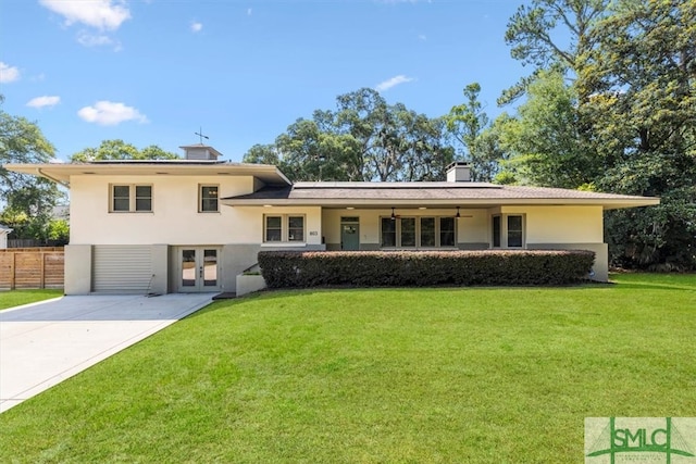 tri-level home featuring a front lawn