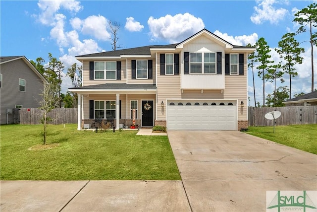 view of front of home with a garage and a front yard