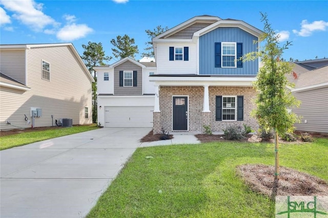 view of front of home with a front lawn, a garage, and central AC