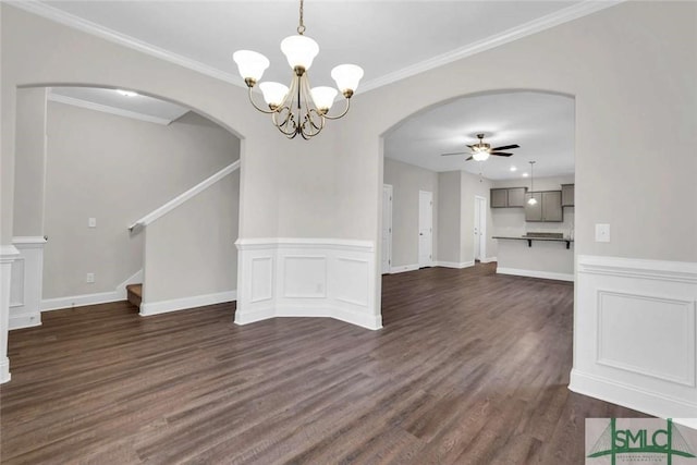 unfurnished dining area featuring crown molding, dark wood-type flooring, and ceiling fan with notable chandelier