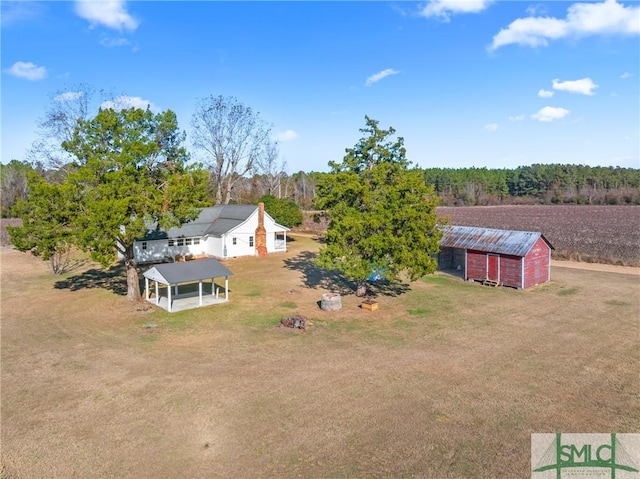 birds eye view of property with a rural view