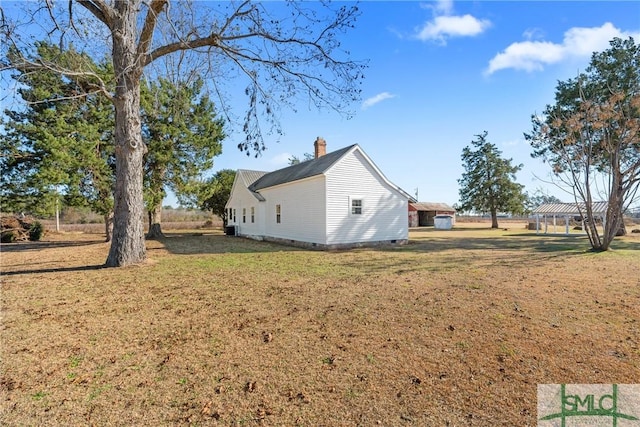 view of property exterior featuring a lawn