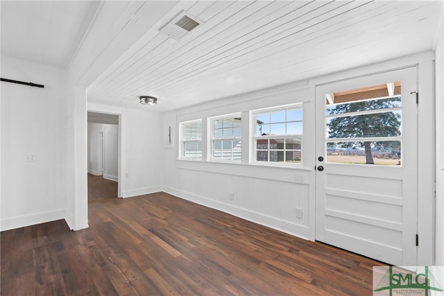 entryway with dark hardwood / wood-style flooring and wooden ceiling