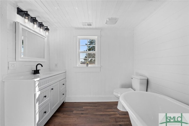 bathroom with vanity, wooden ceiling, toilet, wood-type flooring, and a tub