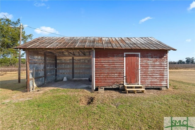 view of outdoor structure with a lawn