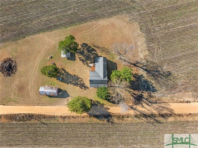 birds eye view of property featuring a rural view