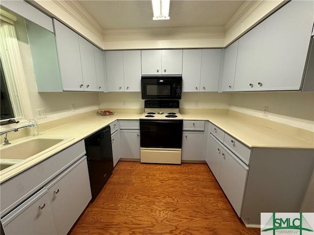 kitchen with gray cabinets, sink, and black appliances