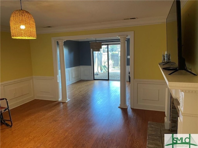 interior space featuring hardwood / wood-style floors and crown molding