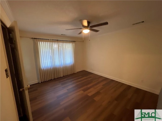 unfurnished room featuring ceiling fan and dark hardwood / wood-style floors