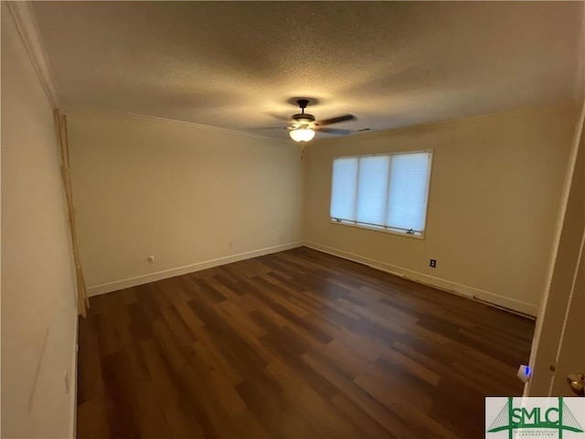 unfurnished room with ceiling fan, dark hardwood / wood-style flooring, and a textured ceiling