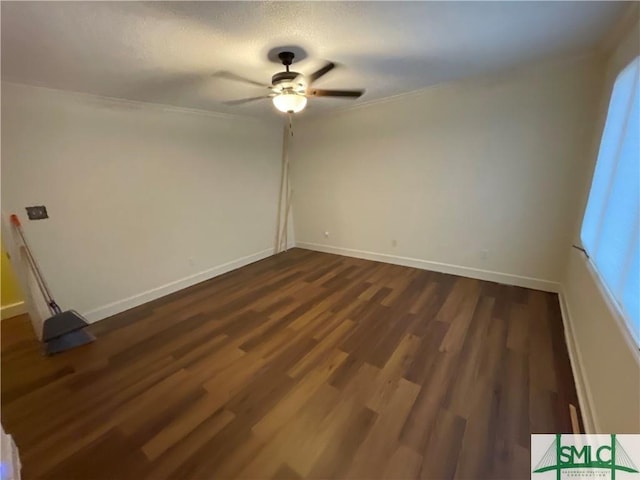 unfurnished room featuring ceiling fan and dark hardwood / wood-style floors