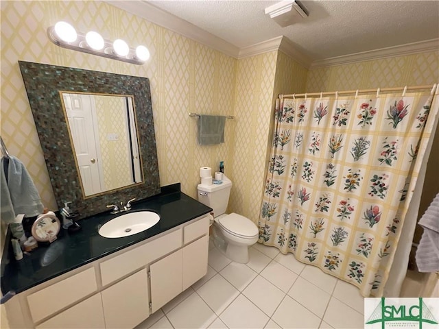 bathroom featuring vanity, tile patterned floors, crown molding, toilet, and a textured ceiling