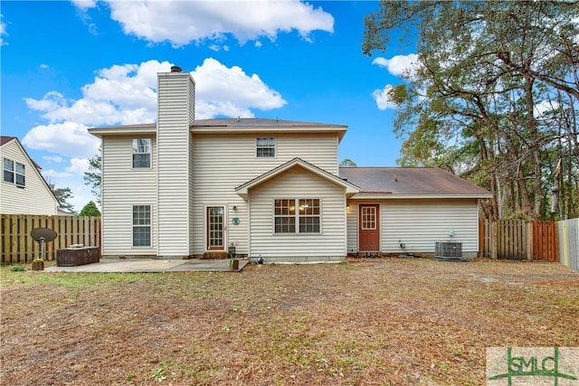 back of house featuring central AC and a patio area