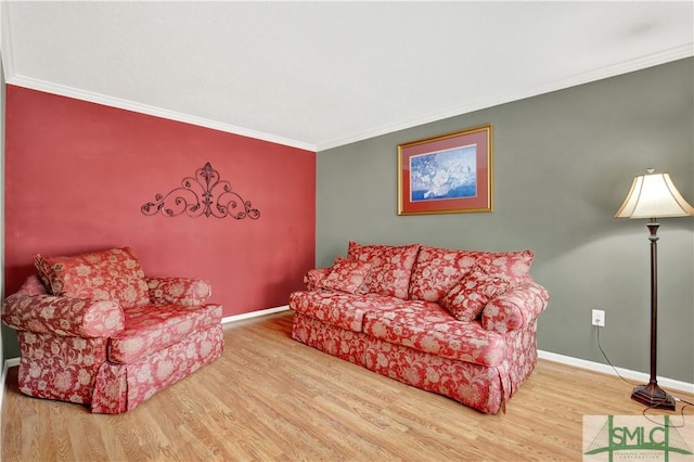 living room with hardwood / wood-style floors and crown molding