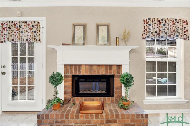 tiled living room with a brick fireplace