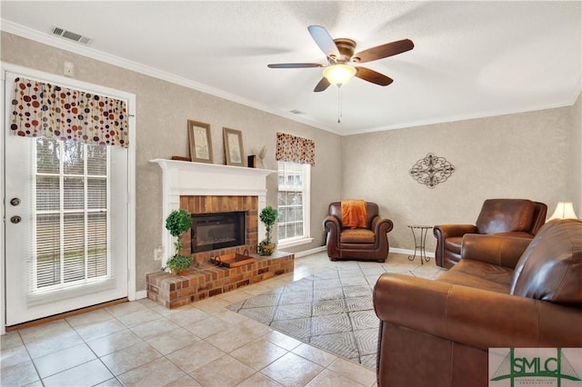 tiled living room featuring a healthy amount of sunlight, crown molding, and a brick fireplace