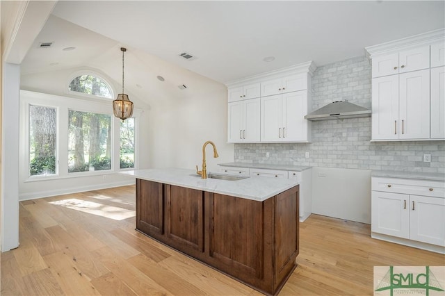 kitchen featuring white cabinets and sink