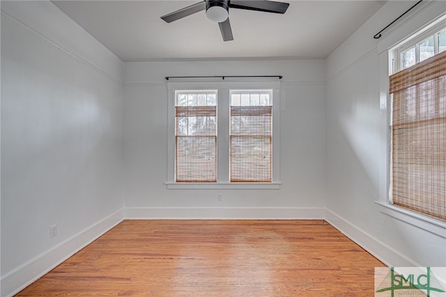 empty room featuring ceiling fan and light hardwood / wood-style flooring